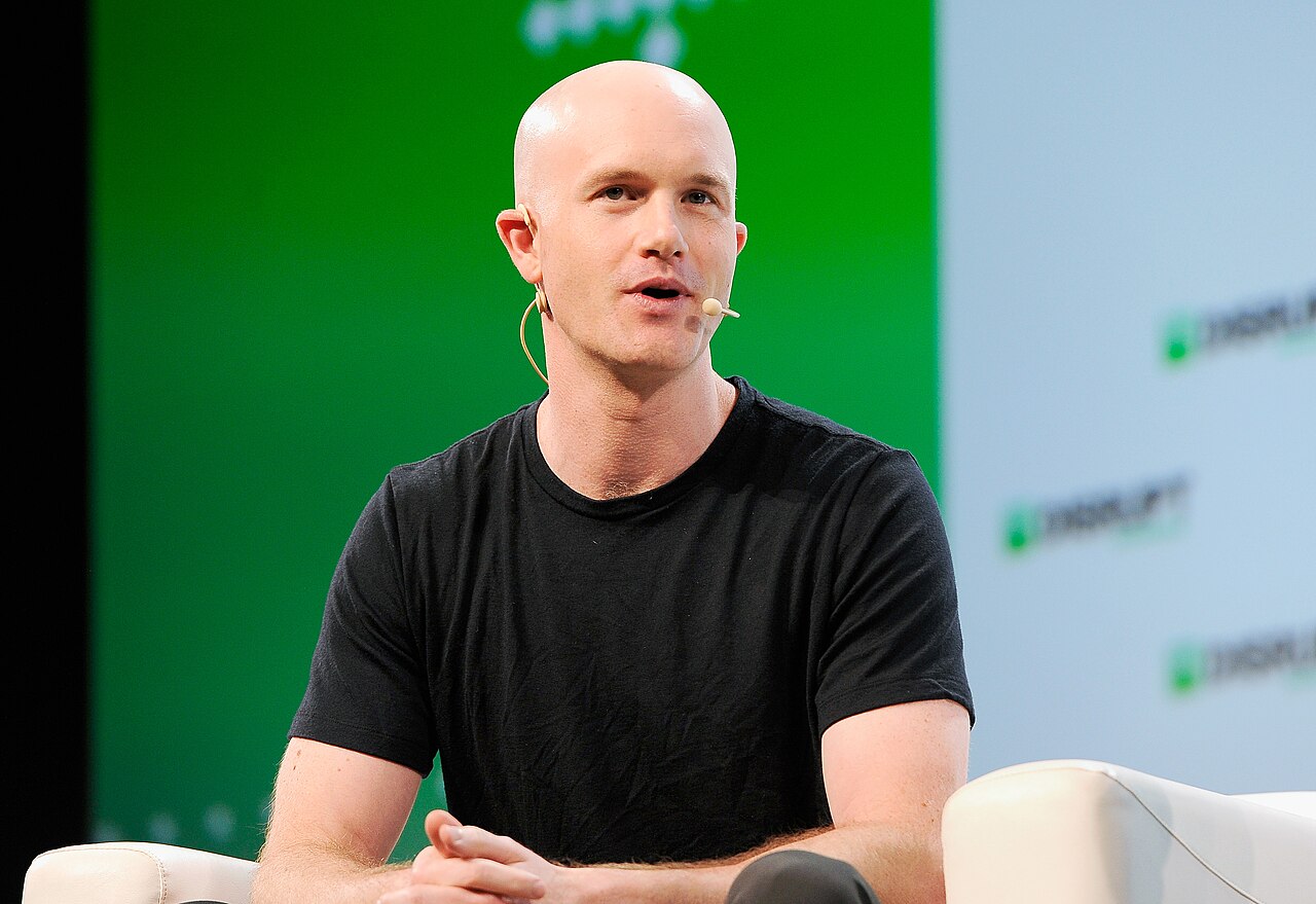 Brian Armstrong in black shirt during a conference