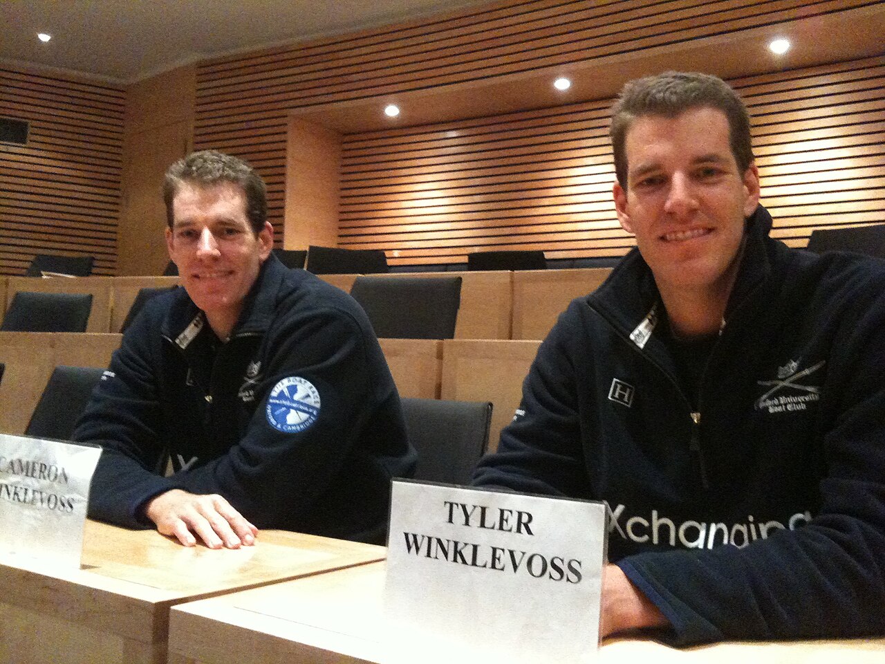 Winklevoss twins - Cameron and Tyler - with their name tags