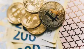 Bitcoin tokens on top of 200 euro banknotes