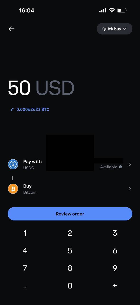 Coinbase Quick buy screen showing a $50 Bitcoin purchase quoted at 0.00062623 BTC with no fee displayed