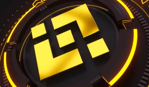A gold Binance (BNB) logo set against a dark, futuristic circular background with glowing yellow accents.