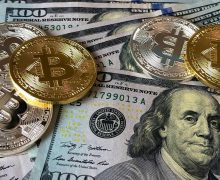 bitcoin sign on top of us dollars