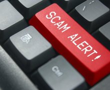 Scam Alert Sign on Keyboard