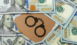 Picture with dollars and handcuffs