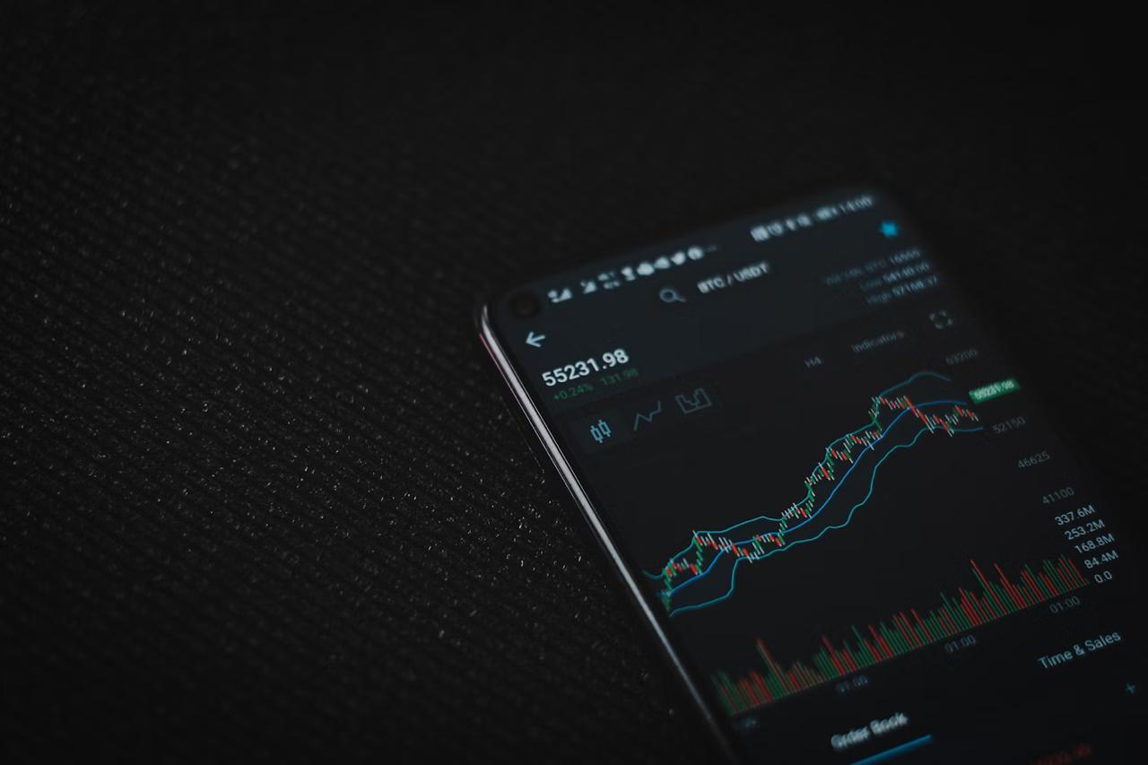 Mobile Phone with trading chart on screen