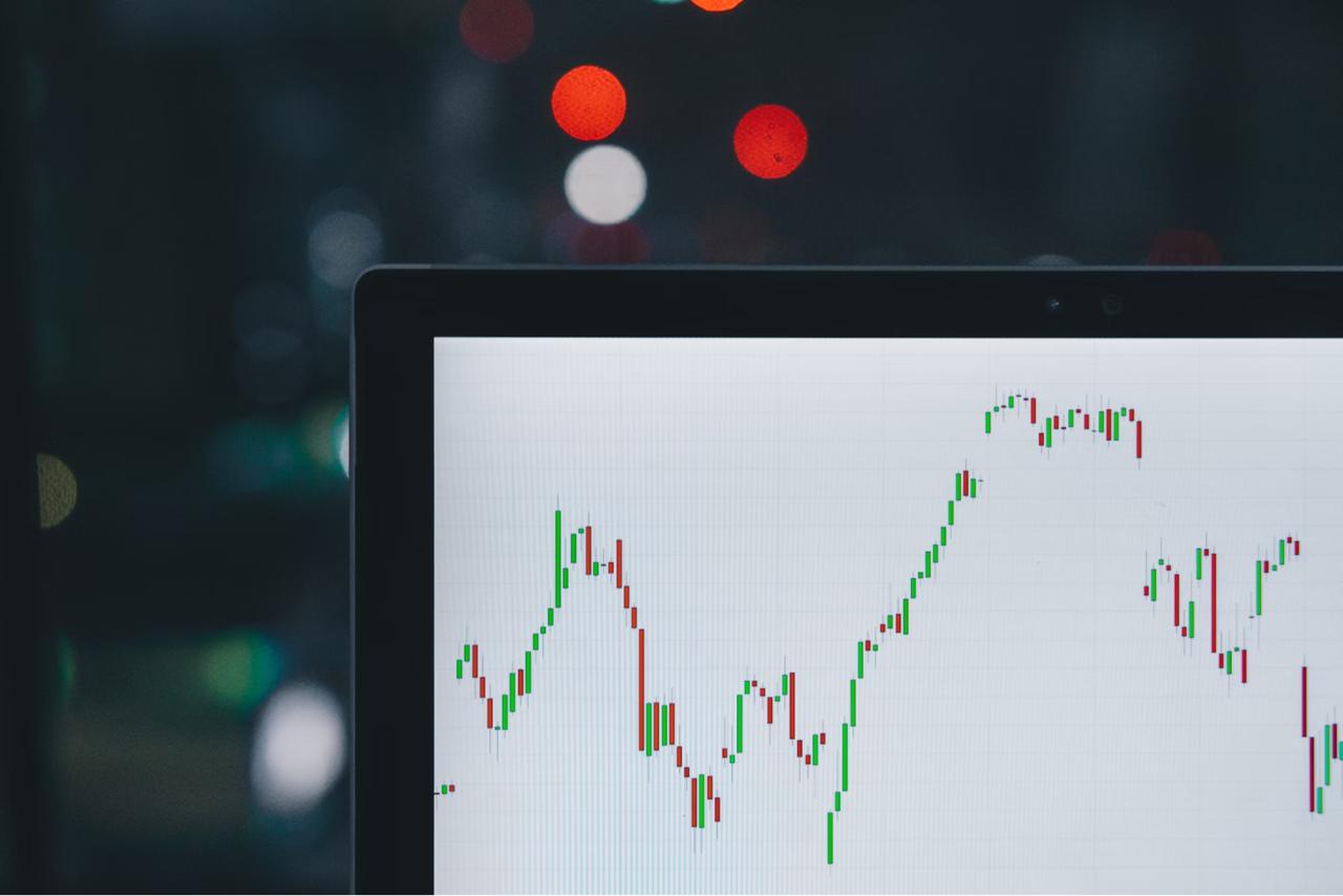 Screen with trading charts on it
