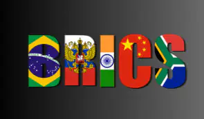 The letters spelling "BRICS" filled with the national flags of Brazil, Russia, India, China, and South Africa against a dark background.