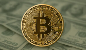 Bitcoin and dollar bills background