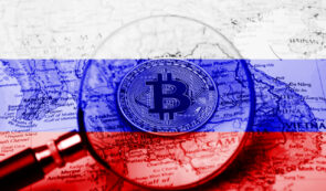 Bitcoin under lense on a map with Russia flag colours