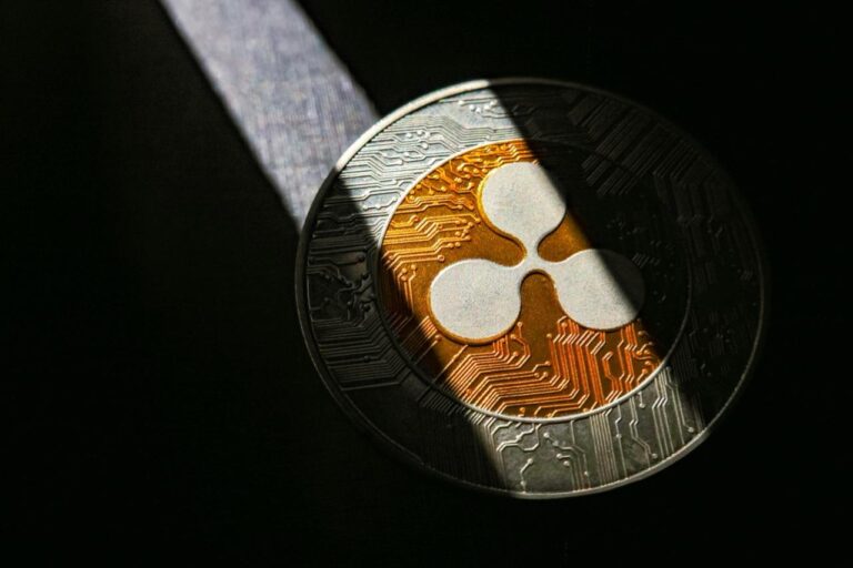 XRP Sentiment Hits 8-Month Low as Price Tests Key SMA50 Resistance
